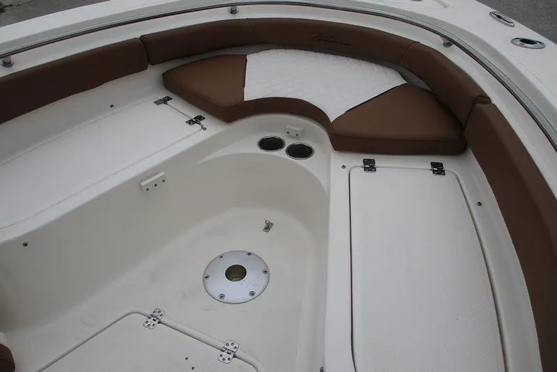 Slide: The Image of 2025 Pioneer 222 Islander boat interior with cushioned seating and storage compartments. - 15