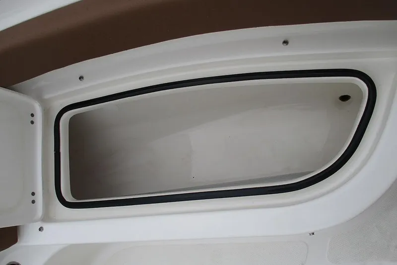 Slide: The Image of Storage compartment on a 2025 Pioneer 222 Islander boat, featuring a sleek design. - 17