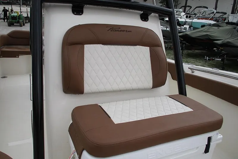 Slide: The Image of Brown and white seating on 2025 Pioneer 222 Islander boat, showcasing luxury design. - 19