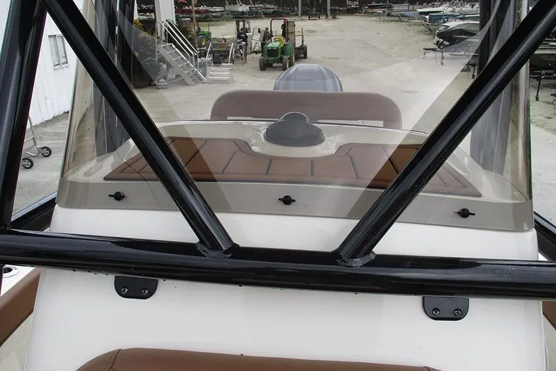Slide: The Image of 2025 Pioneer 222 Islander boat windshield and dashboard view at marina. - 21