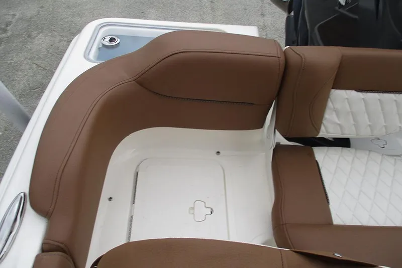 Slide: The Image of 2025 Pioneer 222 Islander boat seating with brown and white upholstery. - 23