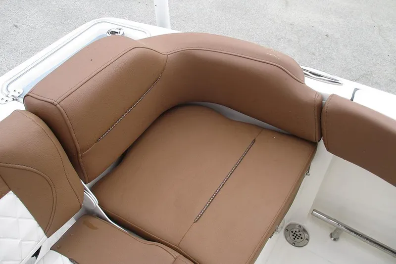 Slide: The Image of Brown leather seating on 2025 Pioneer 222 Islander boat, showcasing comfort and design. - 25