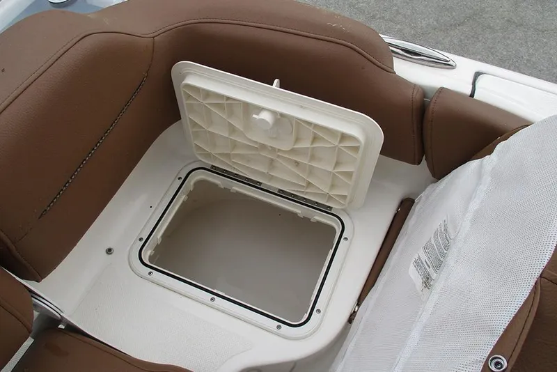 Slide: The Image of Storage compartment on 2025 Pioneer 222 Islander boat with brown seating. - 27