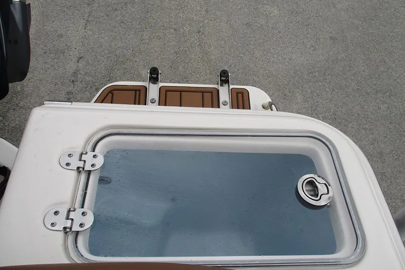 Slide: The Image of 2025 Pioneer 222 Islander boat deck with hatch and latch detail. - 28