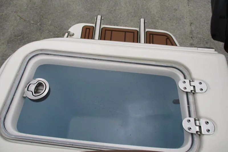 Slide: The Image of 2025 Pioneer 222 Islander boat hatch with stainless steel hinges and latch. - 29