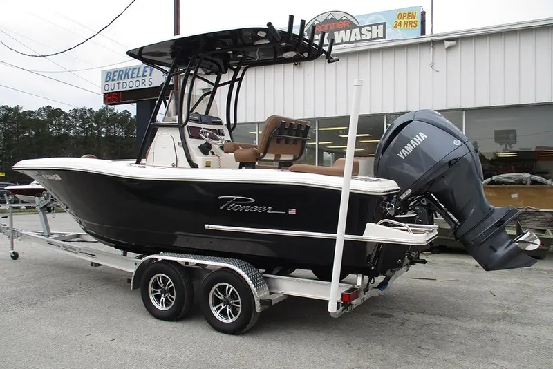 Slide: The Image of 2025 Pioneer 222 Islander boat on trailer with Yamaha outboard motor at dealership. - 3