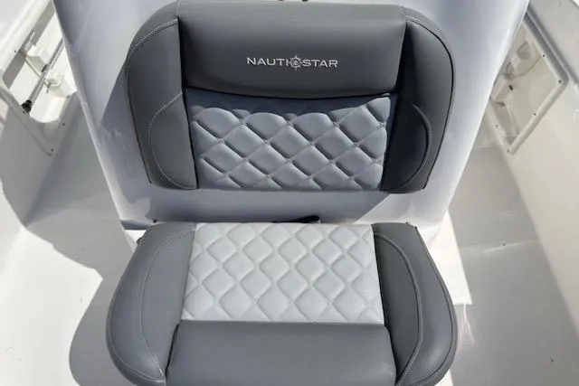 Slide: The Image of 2024 NauticStar 211 Hybrid boat seats with quilted gray upholstery. - 11