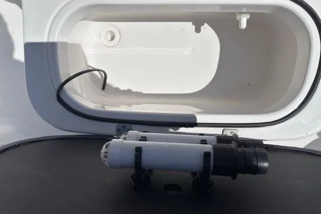 Slide: The Image of 2024 NauticStar 211 Hybrid boat compartment with wiring and component detail. - 12