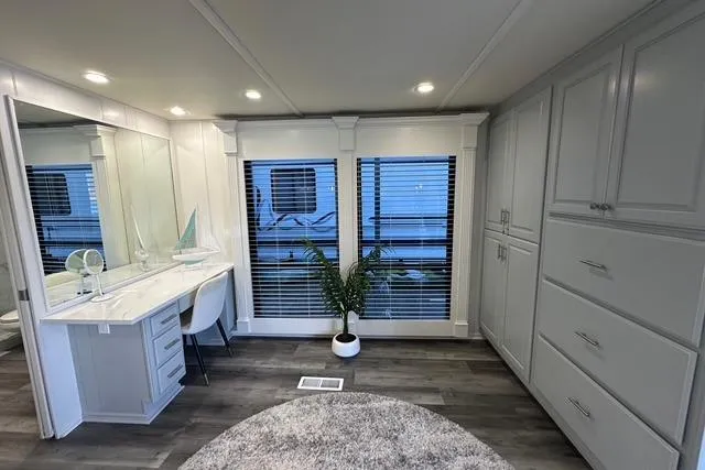 Slide: The Image of Luxurious interior of 1999 Sumerset 18x82 houseboat with modern decor and ample storage. - 11