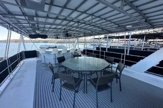 Slide: The Image of Spacious deck of 1999 Sumerset 18x82 houseboat with seating and water view. - 15