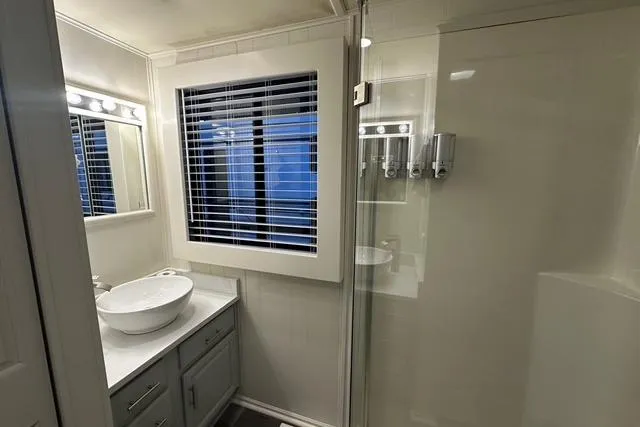 Slide: The Image of Modern bathroom in 1999 Sumerset 18x82 houseboat with vessel sink and shower. - 9