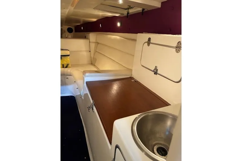 Slide: The Image of Interior of 1984 Cigarette 35' Cafe Racer boat with seating and sink. - 14