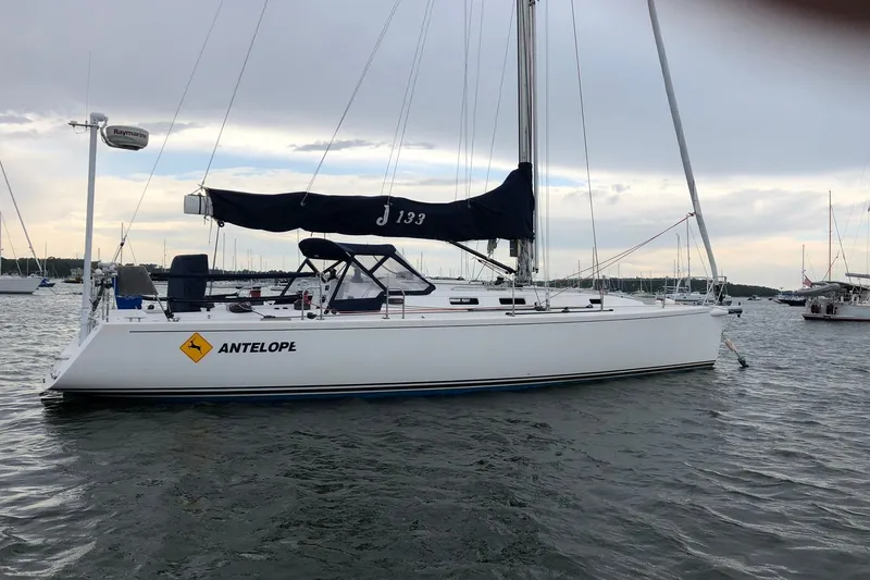 The Image of 2004 J Boats J/133 sailboat named "Antelope" anchored in a marina. - 0