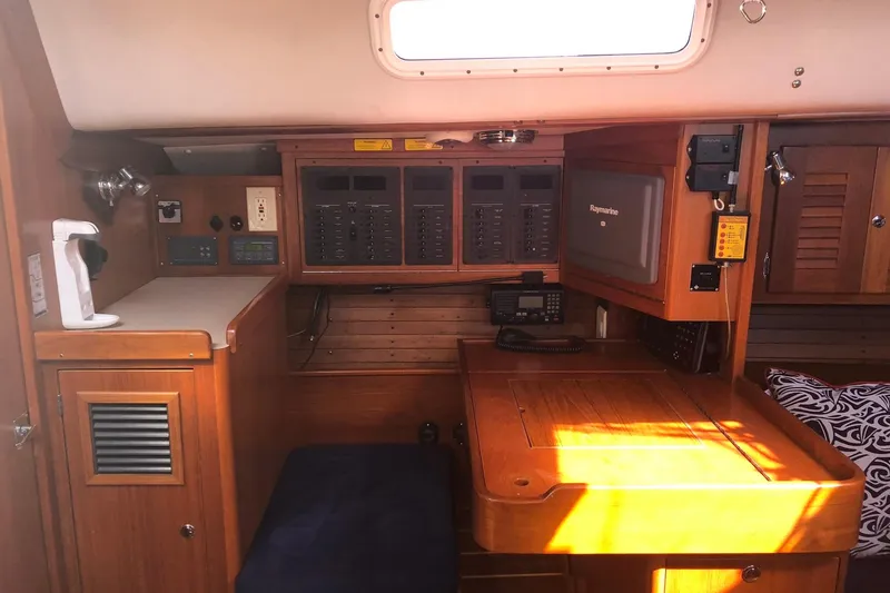 Slide: The Image of 2004 J Boats J/133 yacht interior with navigation station and control panels. - 16