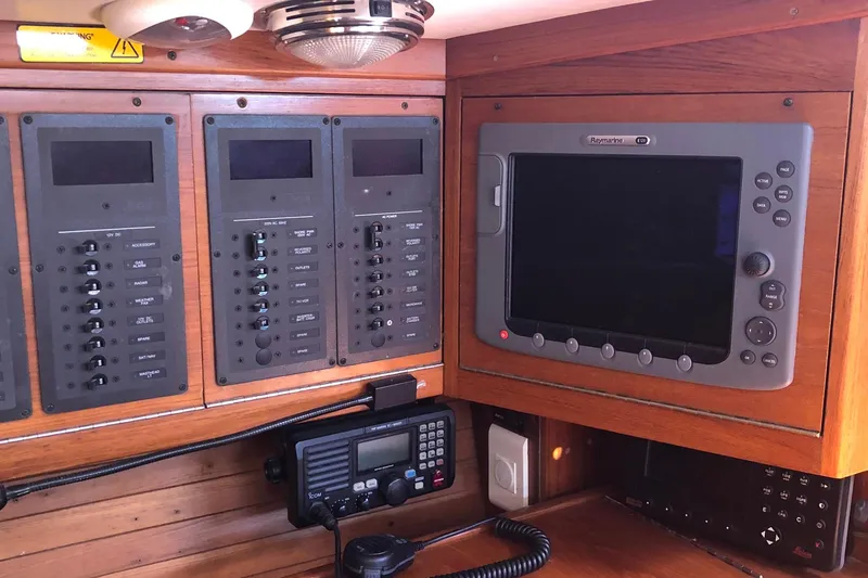 Slide: The Image of Control panel and navigation system inside a 2004 J Boats J/133 yacht. - 19
