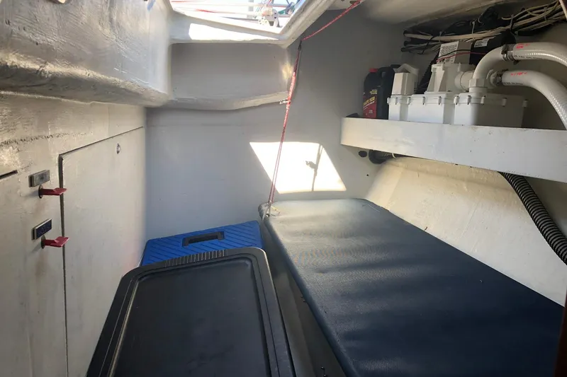 Slide: The Image of Interior of a 2004 J Boats J/133 sailboat showing storage and equipment. - 21