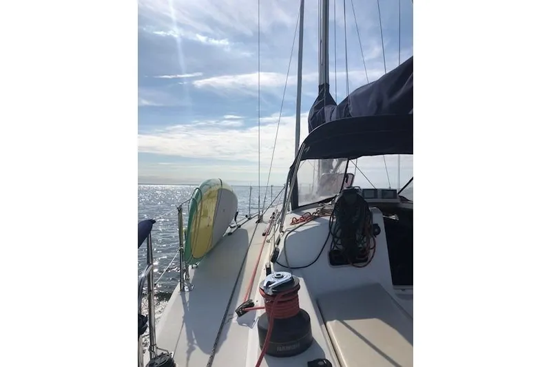 Slide: The Image of Sailing on a 2004 J Boats J/133 yacht under a clear blue sky. - 23