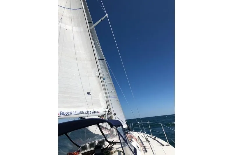 Slide: The Image of Sailing on a 2004 J Boats J/133 under clear blue skies. - 24