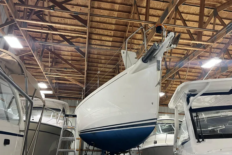 Slide: The Image of 2004 J Boats J/133 sailboat stored indoors, surrounded by other boats. - 27