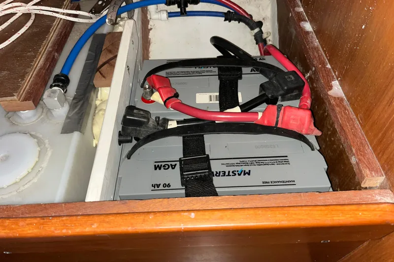 Slide: The Image of Battery compartment of a 2004 J Boats J/133 sailboat with AGM batteries and wiring. - 31