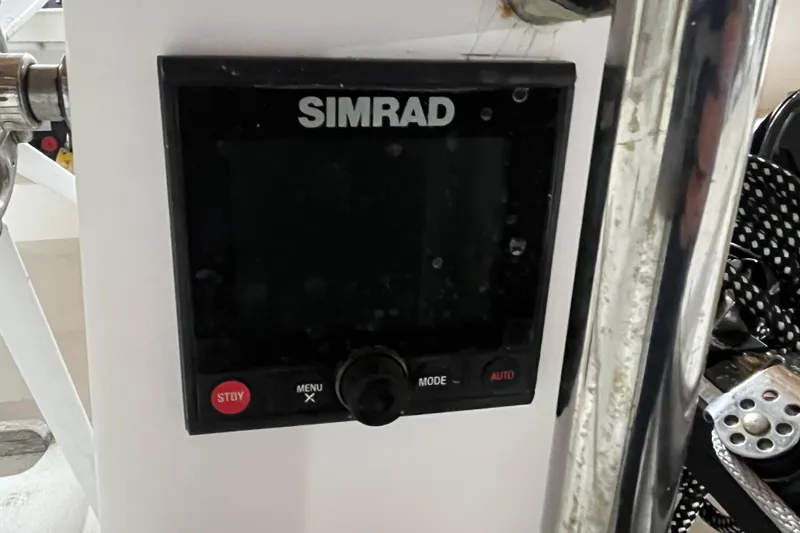 Slide: The Image of Simrad display on 2004 J Boats J/133 yacht, featuring navigation controls. - 32
