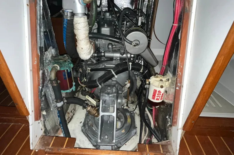 Slide: The Image of Engine compartment of a 2004 J Boats J/133 sailboat, showcasing mechanical components. - 33