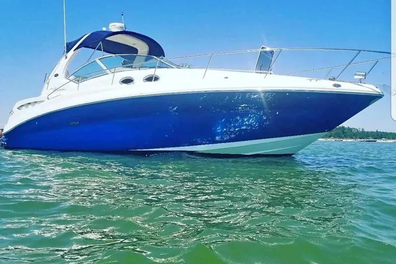 The Image of 2005 Sea Ray Sundancer 320 yacht on clear blue water under sunny sky. - 0