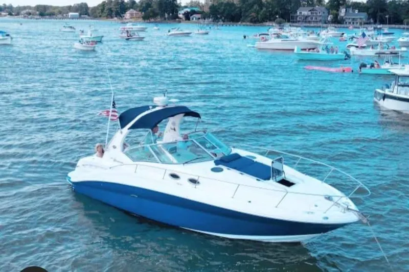 Slide: The Image of 2005 Sea Ray Sundancer 320 yacht on a busy lake with other boats. - 10