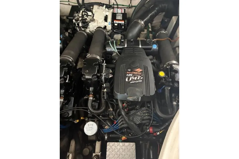 Slide: The Image of Engine compartment of a 2005 Sea Ray Sundancer 320 boat, featuring MerCruiser components. - 19