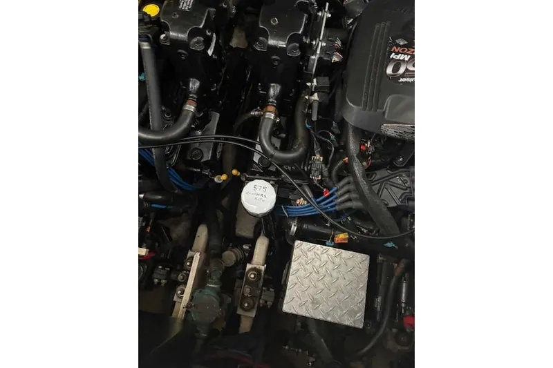 Slide: The Image of Engine compartment of a 2005 Sea Ray Sundancer 320 boat, showing mechanical components. - 20