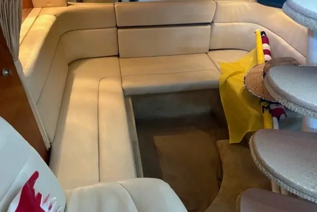 Slide: The Image of Interior of 2005 Sea Ray Sundancer 320 with beige seating and curved design. - 22