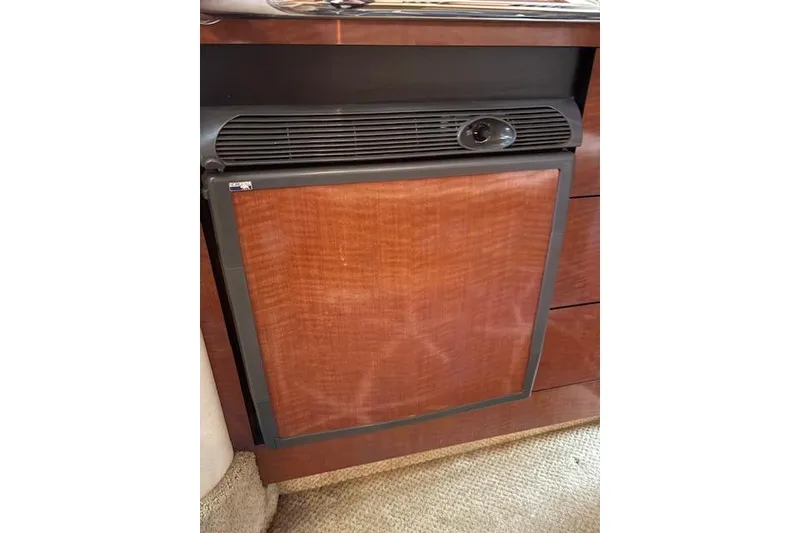 Slide: The Image of Wood-paneled refrigerator in 2005 Sea Ray Sundancer 320 yacht interior. - 24