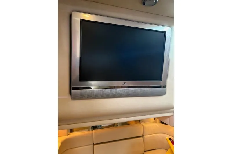 Slide: The Image of Flat-screen TV inside 2005 Sea Ray Sundancer 320 yacht cabin. - 27