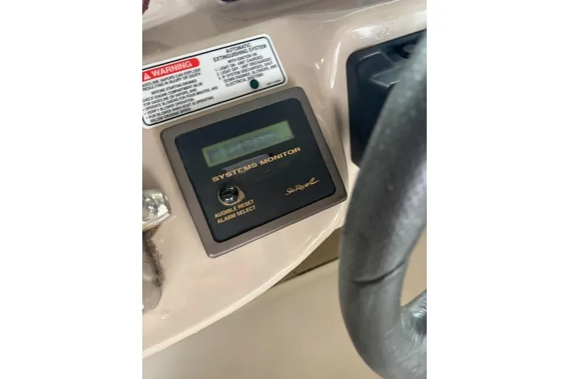 Slide: The Image of Control panel of a 2005 Sea Ray Sundancer 320 boat with system monitor. - 32