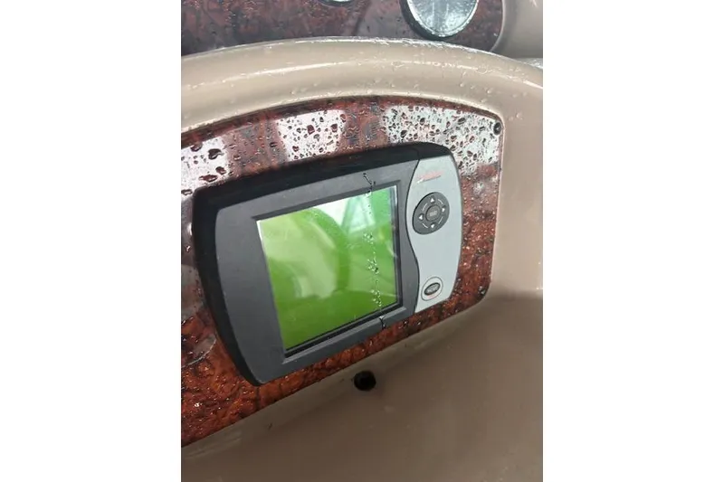Slide: The Image of Dashboard of a 2005 Sea Ray Sundancer 320 with a wet navigation display. - 34