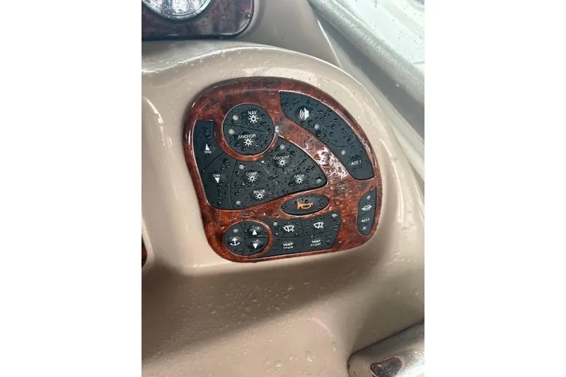 Slide: The Image of Control panel of a 2005 Sea Ray Sundancer 320 boat, featuring various switches. - 36