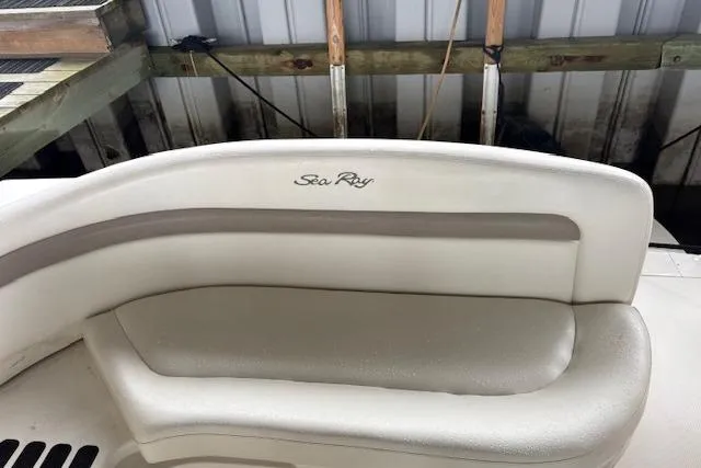 Slide: The Image of 2005 Sea Ray Sundancer 320 boat seating with logo, docked in a marina. - 39
