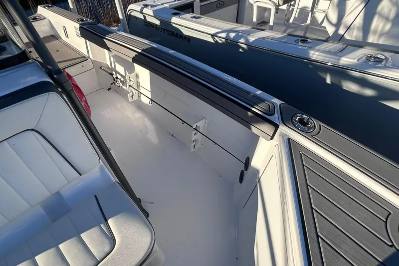 Slide: The Image of 2019 Yamaha Boats 210 FSH Sport interior with seating and storage features. - 13
