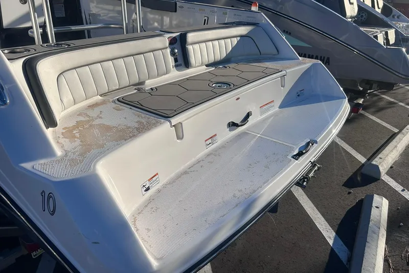 Slide: The Image of 2019 Yamaha Boats 210 FSH Sport rear view, featuring seating and deck area. - 5