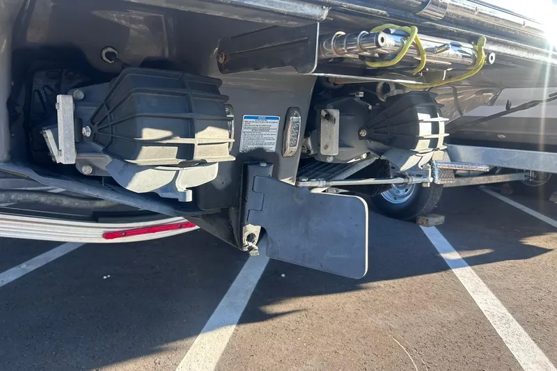 Slide: The Image of 2019 Yamaha Boats 210 FSH Sport jet propulsion system in a parking lot. - 7