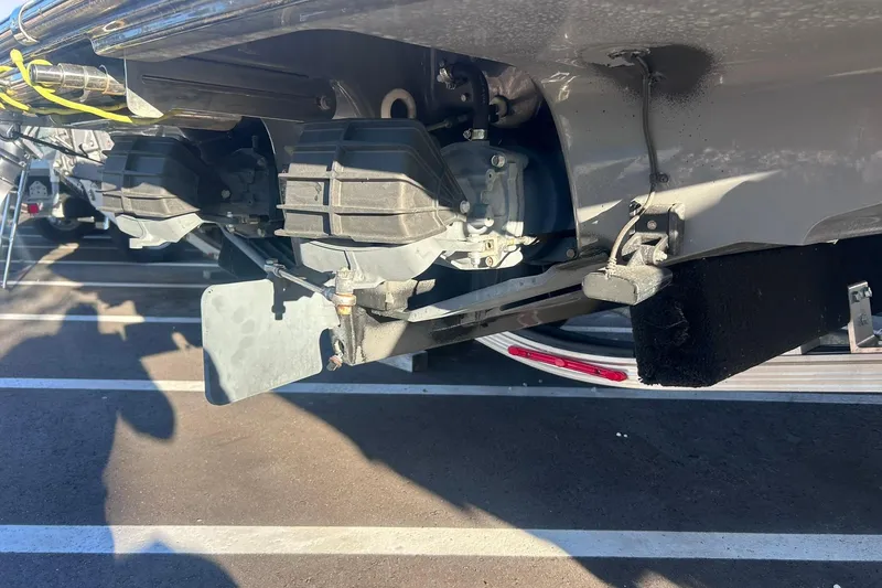 Slide: The Image of 2019 Yamaha Boats 210 FSH Sport jet propulsion system close-up in parking lot. - 8