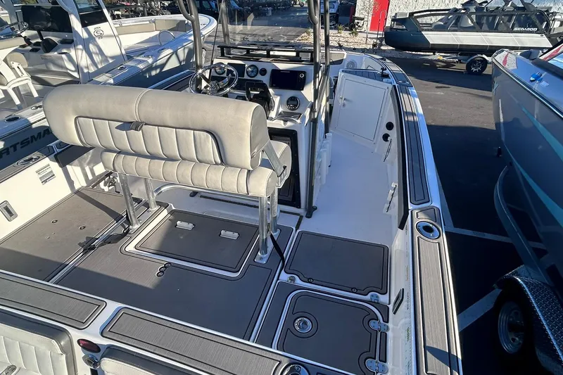 Slide: The Image of 2019 Yamaha Boats 210 FSH Sport interior with seating and control panel. - 9