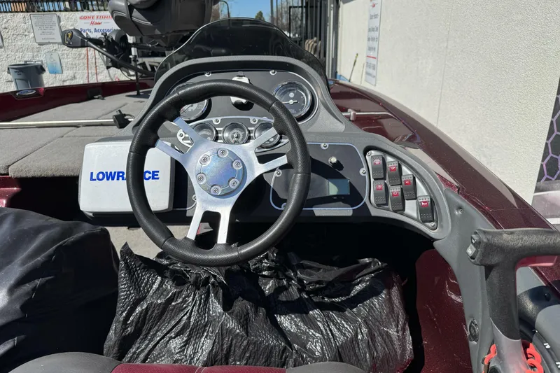 Slide: The Image of 2010 Ranger 178 VS boat dashboard with steering wheel and Lowrance electronics. - 13