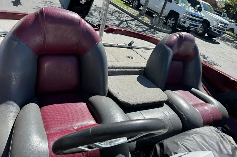 Slide: The Image of 2010 Ranger 178 VS boat interior with maroon and gray seats. - 14