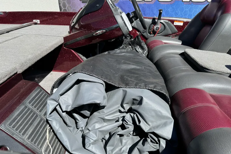 Slide: The Image of 2010 Ranger 178 VS boat interior with rolled tarp on seat. - 8