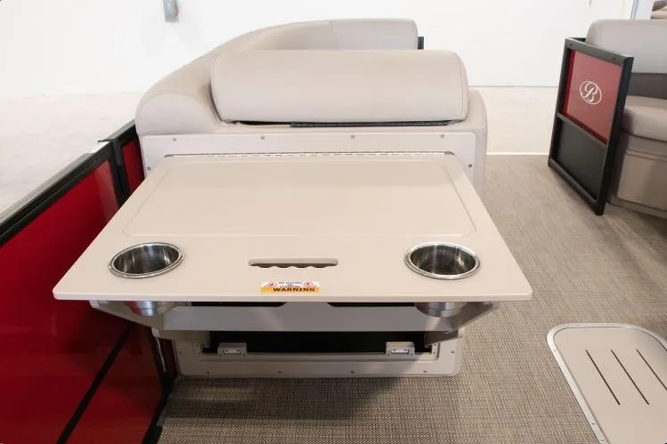 Slide: The Image of 2026 Bentley Pontoons Legacy 243 Swingback interior with foldable table and cup holders. - 6
