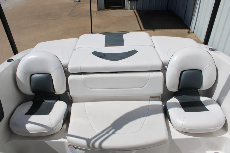 Slide: The Image of 2021 Chaparral 19 SSi Ski & Fish boat interior with white and gray seating. - 14