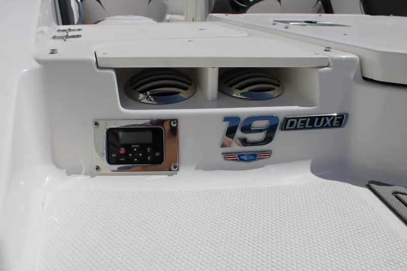 Slide: The Image of 2021 Chaparral 19 SSi Ski & Fish boat interior with deluxe badge and control panel. - 19