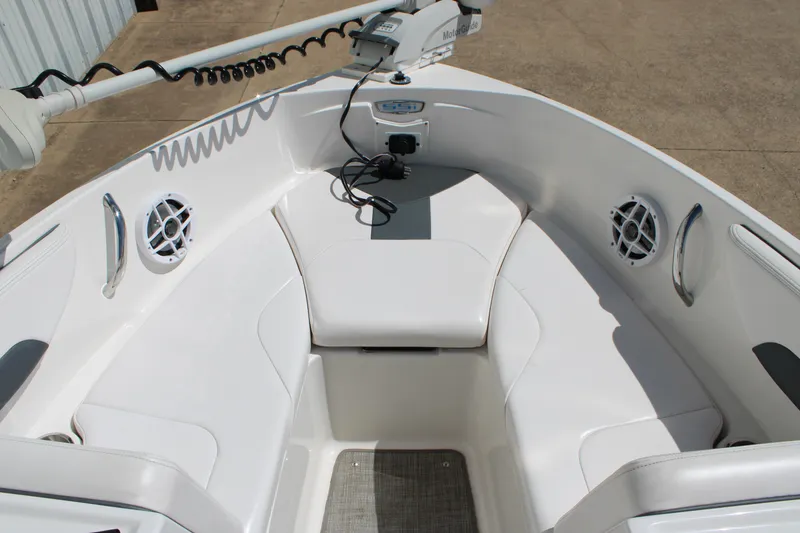 Slide: The Image of 2021 Chaparral 19 SSi Ski & Fish boat interior with seating and speakers. - 6