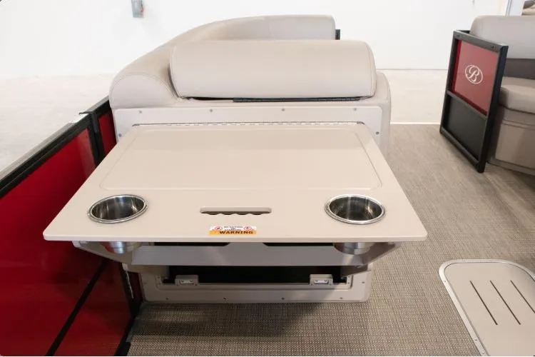 Slide: The Image of Interior of 2026 Bentley Pontoons Legacy 243 Navigator Ext with foldable table and cup holders. - 3